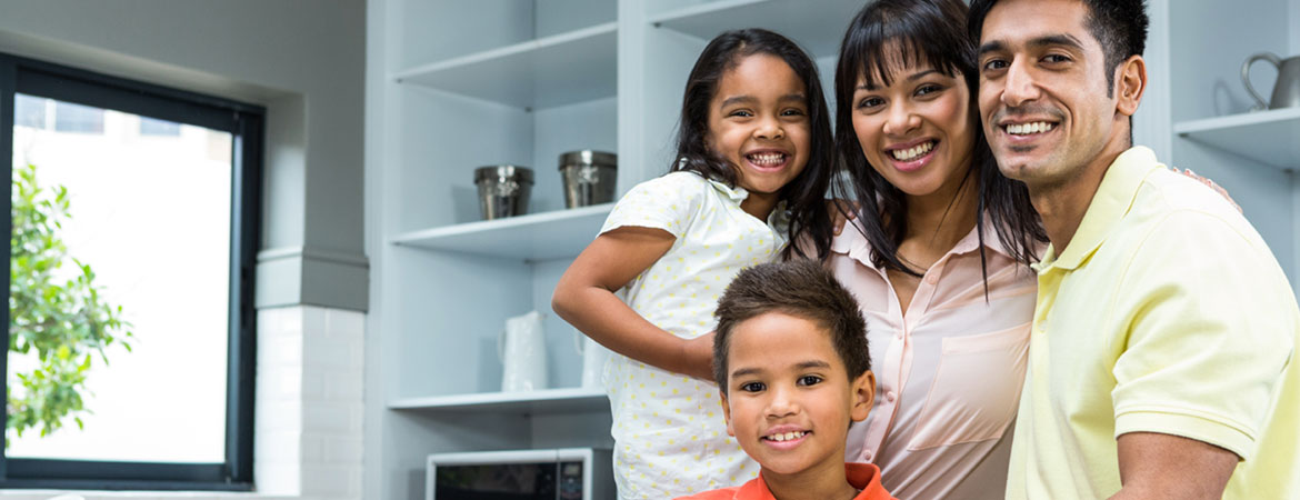 Doctor with child patient and mom