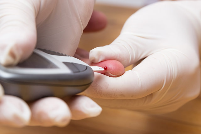 Doctor taking patients blood